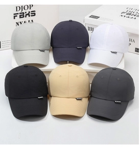 Detailed view of sun protective baseball caps in six neutral colors with logo labels