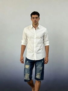 Men's summer casual outfit with white long-sleeve shirt and blue distressed denim shorts