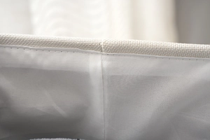 Close-up of durable cotton linen stitching and thick fabric texture on the storage basket