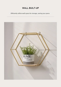Detail of a Nordic hexagonal gold iron wall shelf with a sturdy natural wood base