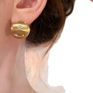 Modern 18k gold plated brushed metal dome stud earrings with star-set cubic zirconia accents