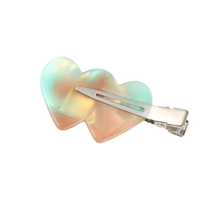 Pearlescent heart-shaped acetate hair clip with blue and pink gradient design