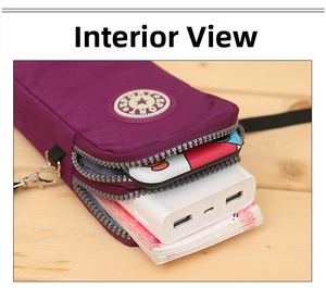 Internal view of purple nylon crossbody bag showing three zipper pockets and large capacity