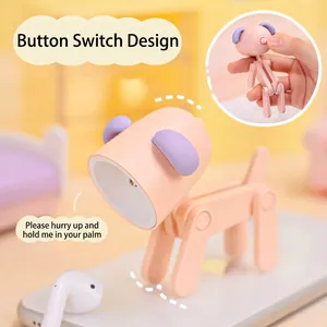 Mini LED puppy night light in pink and purple with adjustable joints and a phone stand