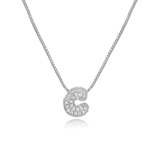 Macro shot of silver initial C pendant with pavé set cubic zirconia on box chain