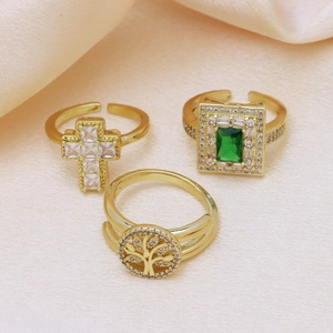 Adjustable 18k gold plated ring set featuring cross, green gemstone, and tree of life motifs