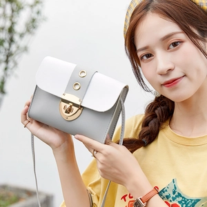 Women's small square crossbody bag in white and grey patchwork with gold buckle