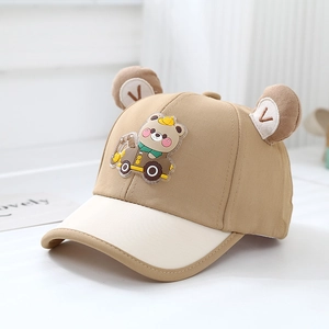 Detail of baby baseball cap with 3D bear ears and cartoon car patch on breathable cotton
