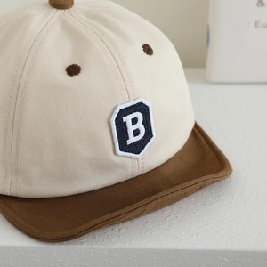 Toddler baseball cap with letter B embroidery in cream and dark brown contrast