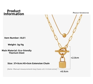 Detail of double-layer gold titanium steel necklace with OT buckle and lock pendant