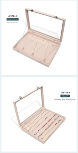 Pink velvet jewelry display box with transparent lid and metal clasp for necklaces