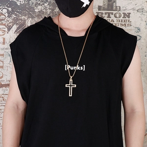 Hip hop gold hollow cross pendant necklace on model with graffiti background view