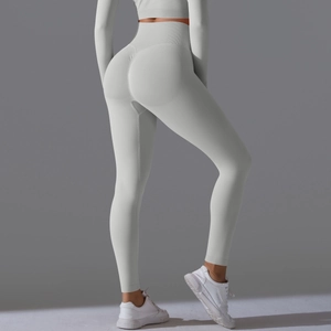 Macro view of light grey seamless ribbed fabric and ruched butt lifting seam detail