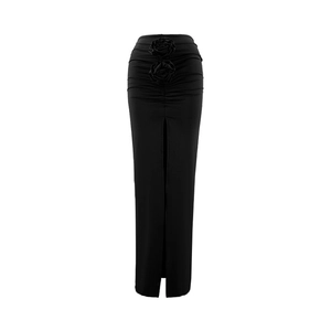 Detail of high waist black skirt featuring 3D rose ornaments and side slit design