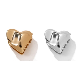 Minimalist heart-shaped metal hair claws in elegant gold and silver finishes