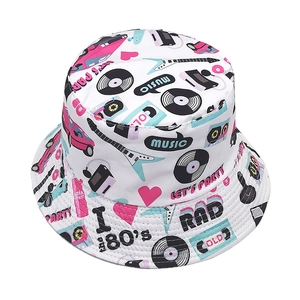 Detail of 80s vintage bucket hat with music cassettes and retro lifestyle patterns