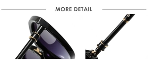 Detail of black glossy sunglasses frame with purple gradient lenses and gold hardware