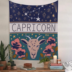Detail of Capricorn tapestry featuring a hand-drawn goat and vibrant floral patterns