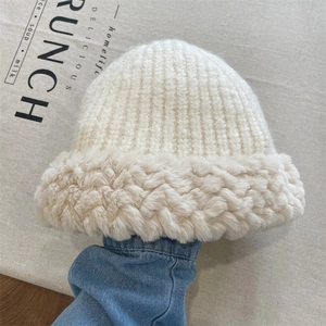 Winter chunky knit beanie for women featuring fluffy faux fur trim in cream white color