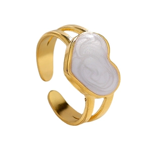 Minimalist gold adjustable heart ring with white pearlescent enamel in a 45-degree view