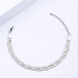 Macro shot of triple-braided stainless steel snake chain bracelet with adjustable lobster clasp