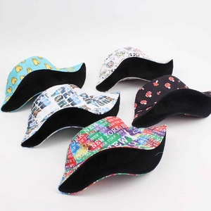 Five reversible graffiti bucket hats featuring mushroom and duck prints in various colors