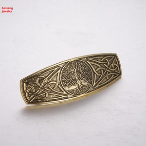 Detailed view of the Tree of Life bronze hair clip with Celtic knot relief patterns