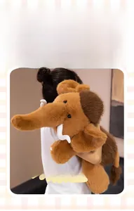 Close-up of fluffy mammoth plush toy featuring a curled trunk and long brown faux fur