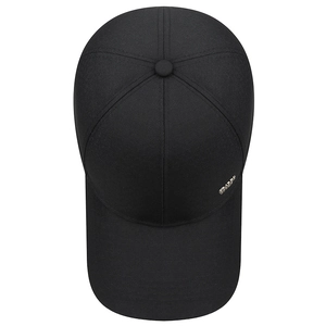 Classic black six-panel baseball cap with metal logo detail, top view on white background