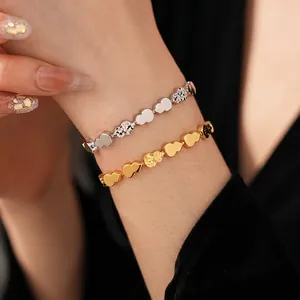 Gourd link bracelet in gold and silver finish with polished and hammered texture