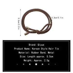 Elastic braided hair tie in dark brown with elegant gold metal cylinder caps