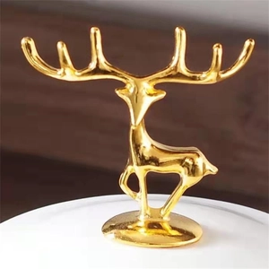 Macro shot of gold zinc alloy deer ornament with high-gloss finish for home decor