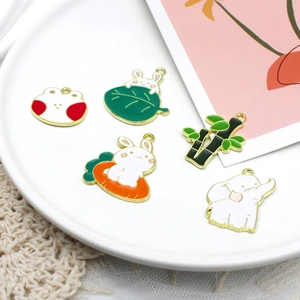 DIY colorful enamel charms featuring cute rabbits and carrots for creative jewelry making