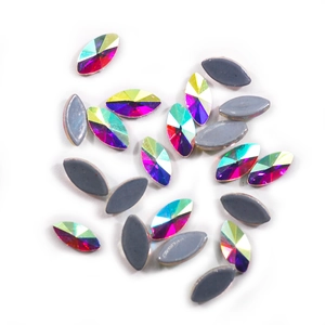 Macro detail of horse eye-shaped AB crystals with iridescent shimmer and flat back