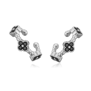 Detail of silver clover ear cuffs featuring black petal stones and luxury finish