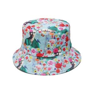 Detail of artistic Frida Kahlo print on blue reversible sun bucket hat canvas fabric