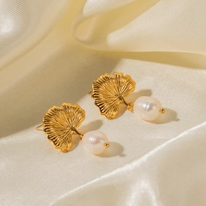 Elegant 18k gold stainless steel ginkgo leaf earrings with white freshwater pearl on silk