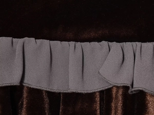 Detail of dark brown velvet fabric spliced with grey pleated chiffon ruffle trim