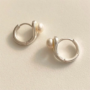Close-up of S925 sterling silver pearl hoop earrings with authentic hallmark engraving