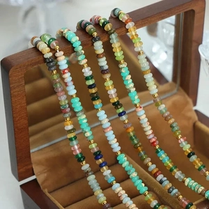 Luxury handmade abacus bead necklace with natural colorful gemstones and gold accents