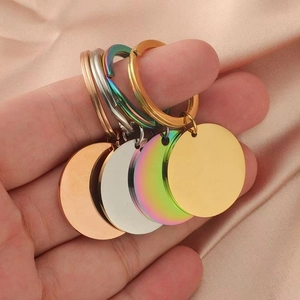 Polished stainless steel round keychains in rose gold, silver, rainbow, and gold colors