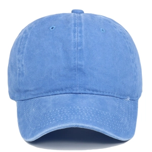 Front view of washed blue cotton baseball cap showing vintage texture and curved brim