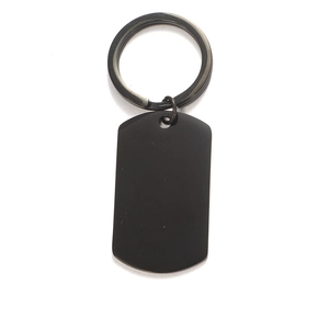Macro shot of blank matte black stainless steel dog tag keychain for DIY laser engraving