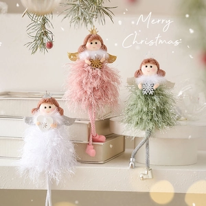 Three plush Christmas angel ornaments in pink green and white for festive tree decoration
