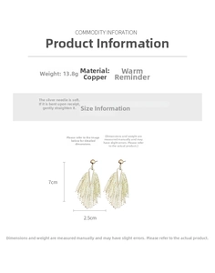 Detail view of golden tassel earrings with silver needles and copper material dimensions