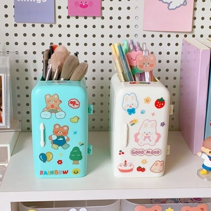 Detail of cute refrigerator shaped pen holder with cartoon stickers and dual colors