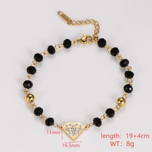 Detail of diamond-shaped charm on gold and black beaded bracelet with size dimensions