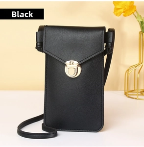 Detail of black crossbody phone bag with gold metal clasp and pebble leather texture