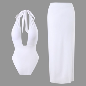Detail of white halter neck bodysuit with matching high waist long skirt two-piece set
