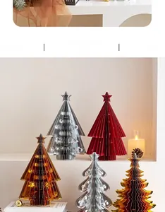 Macro shot of multi-colored origami paper Christmas trees with metallic star toppers